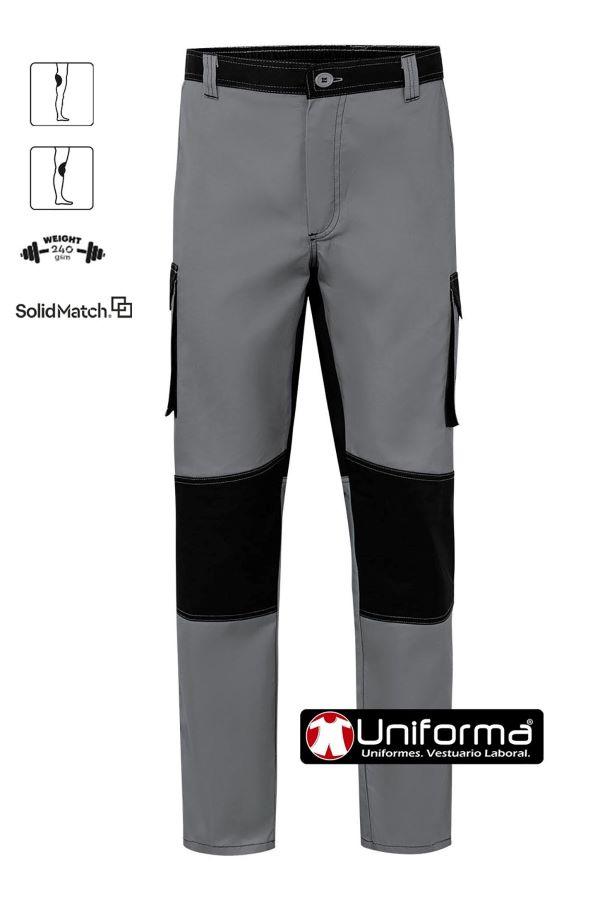 Pantalón de trabajo duro y resistente de gramaje alto con refuerzos de tejido en culera y rodilleras, de diseño bicolor, de la gama solid Match, personalizable con logo de empresa en uniforma. 