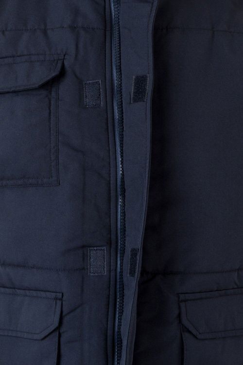 Chaleco de trabajo azul marino confeccionado en tejido de microfibra con forro de guata aislante contra el frío, personalizable con logo de empresa para una imagen profesional en Uniforma - V205901