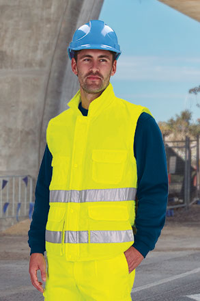 Chaleco de trabajo amarillo flúor reflectante Acolchado de Alta visibilidad EN ISO 20471 clase 1 en tejido de Sarga de 100% poliéster con tacto algodón, de cuello alto y corta vientos, personalizable con logo de empresa en Uniforma - VL2725