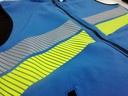 Chaleco cortavientos softshell con bandas reflectantes y bandas de alta visibilidad amarillo flúor, de tipo segmentada, personalizable con logo de empresa en Uniforma.  - VL1046